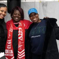 three women smiling at tailgate